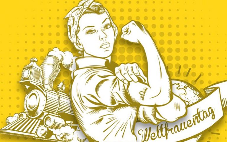Comic einer Frau, die den Arm anwinkelt und ihre Musekln zeigt. Dahinter ist ein Zug und eine Weltkugel zu sehen, darauf ein Banner mit "Weltfrauentag".